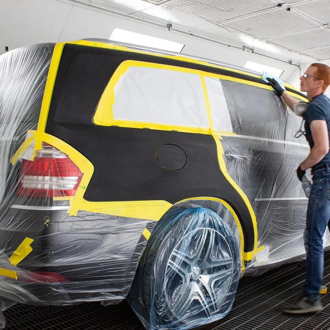 Vehicle masked for custom paint in the Paramount Auto Body spray booth